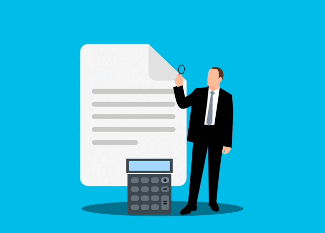 man calculating his taxes