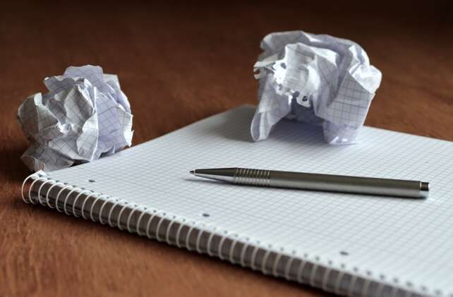 a crumbled piece of paper with a credit memo on it